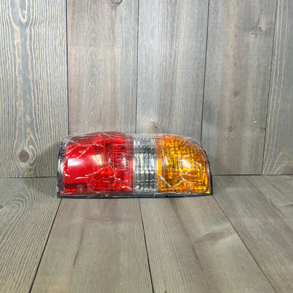 Rear brake light replacement for 2001-2004 Toyota Tacoma, showcasing left driver side tail lamp design.