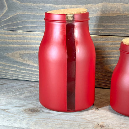 Red 68-ounce jar with cork lid and vertical window, part of French Home Set. Perfect for stylish kitchen storage.