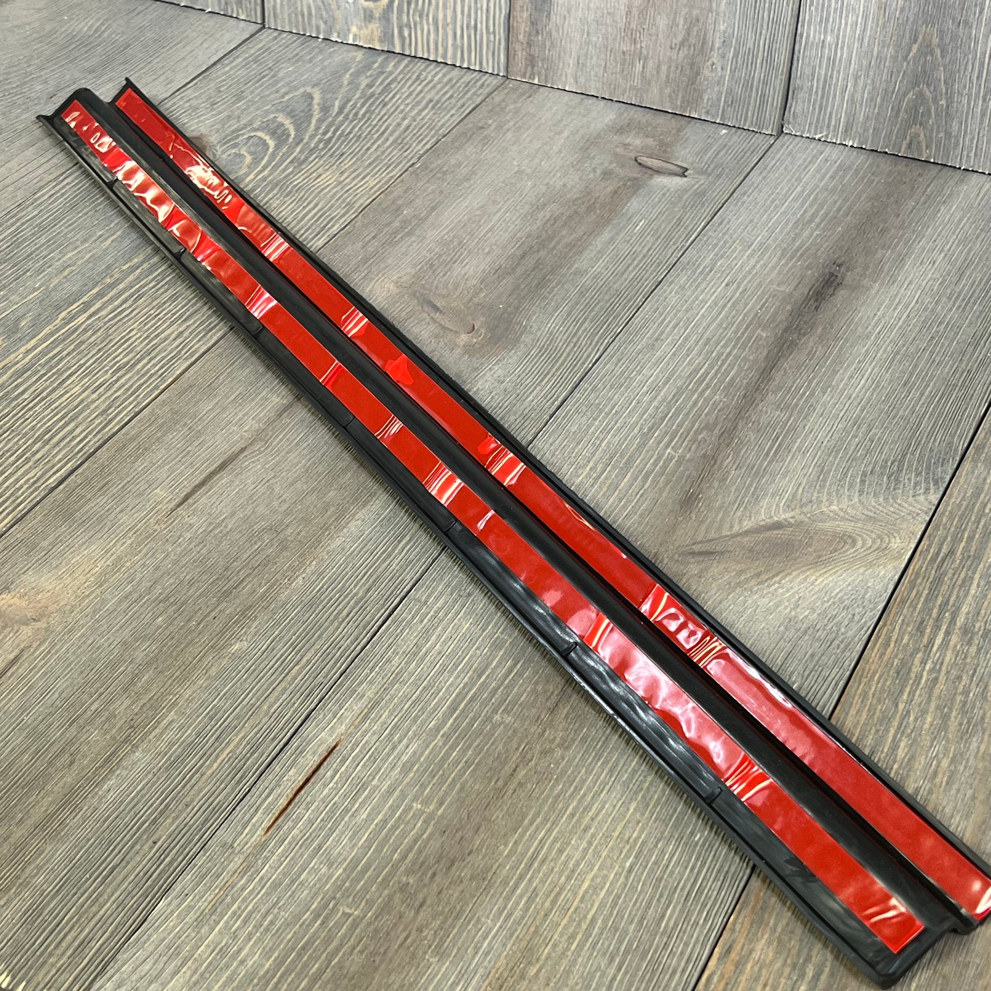 Black thermoplastic entry guards for Jeep Wrangler TJ/LJ, showing durable construction and no-drill installation.