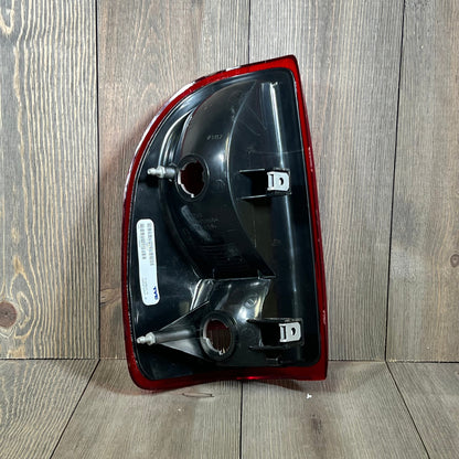 TYC right tail light assembly for 1997-2004 Dodge Dakota, rear view showing mounting points and part details.