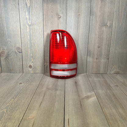 TYC right tail light assembly for 1997-2004 Dodge Dakota, featuring durable red and clear lens design.
