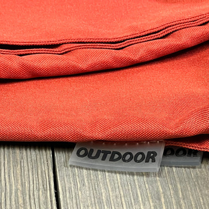 Burnt brick outdoor pillow covers with waterproof fabric, ideal for patio or garden, showcasing durable stitching and texture.