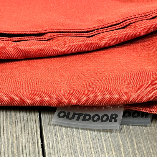 Burnt brick outdoor pillow covers with waterproof fabric, ideal for patio or garden, showcasing durable stitching and texture.