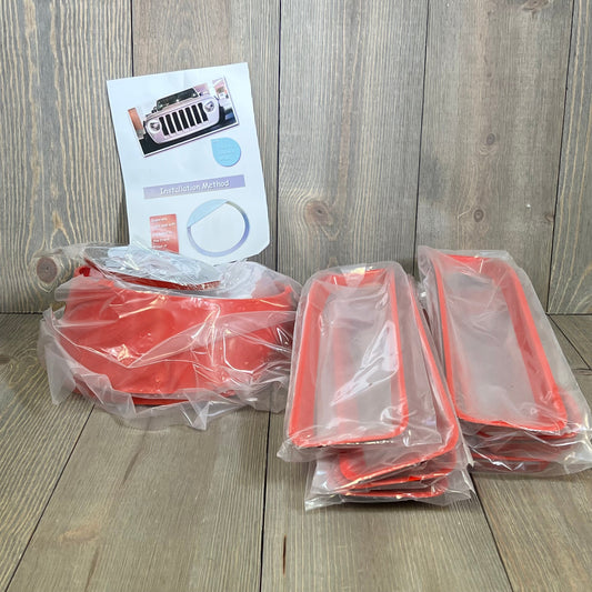 Red grille mesh inserts and headlight covers for Jeep Wrangler JL JLU 2018-2023, packaged with installation guide.