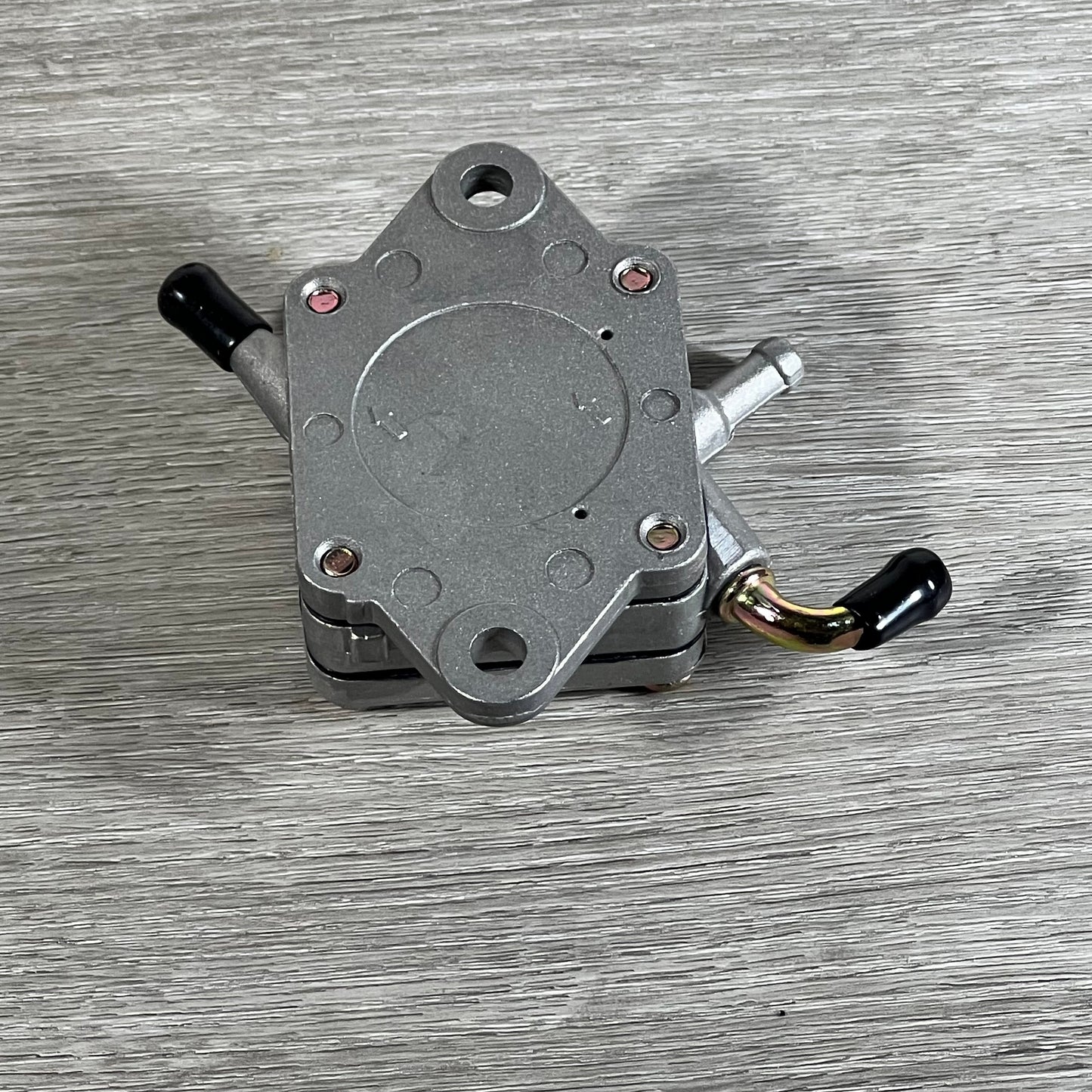 Replacement Cylinman carburetor for John Deere mowers, featuring durable metal construction and precise fittings.