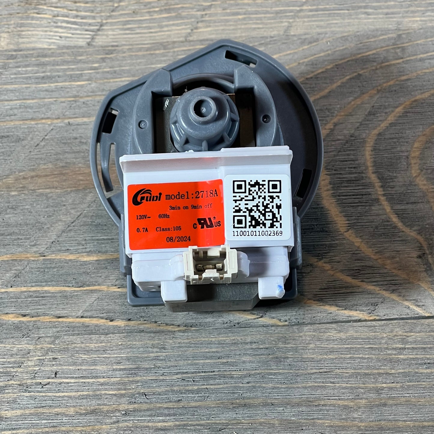 Replacement dishwasher drain pump assembly for Kenmore Frigidaire models, featuring model 2718A details.