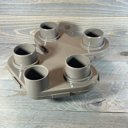 Replacement top manifold for Hayward Swim Clear filter, featuring five connection ports on a wooden background.
