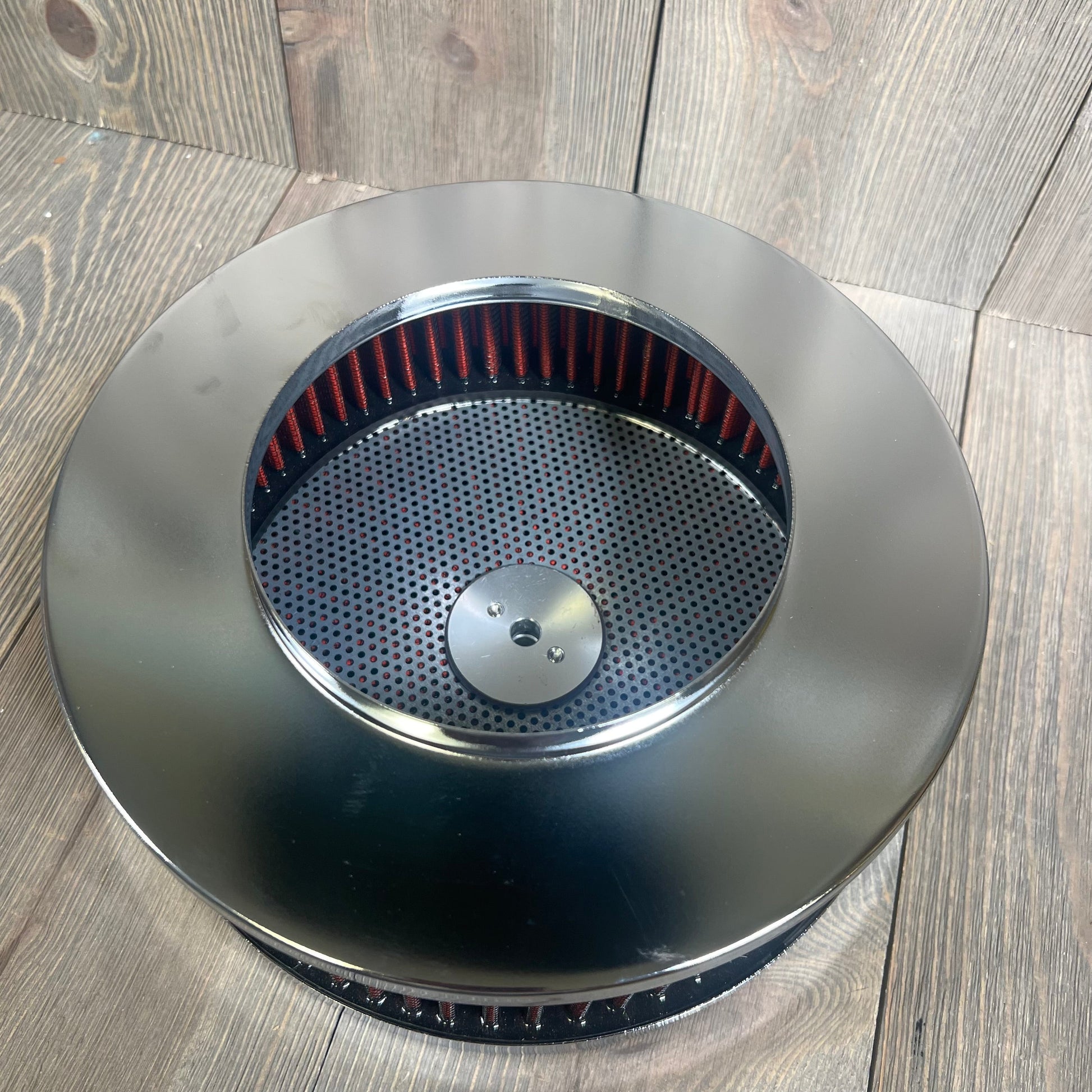 Red round air filter assembly kit with black metal finish, designed for V8 engines. Washable, reusable, includes mounting stud.