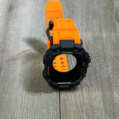 Bright orange ULTIMAL Rugged Case with Band for Apple Watch 46mm, showcasing military-grade shockproof design on wood surface.