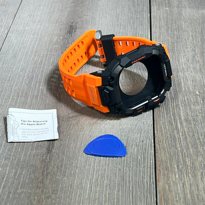 Orange rugged case with tactical band for Apple Watch 46mm, military grade shockproof design, includes release tool.