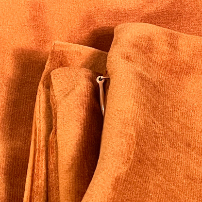 Burnt orange velvet throw pillow covers with zipper detail, perfect for enhancing couch and bed decor, 16x16 inches.