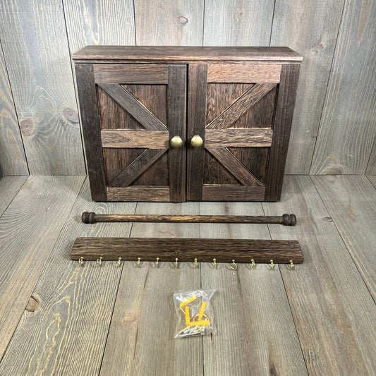 Rustic wooden jewelry organizer with barn door design, includes hooks and mounting hardware for necklaces and earrings.