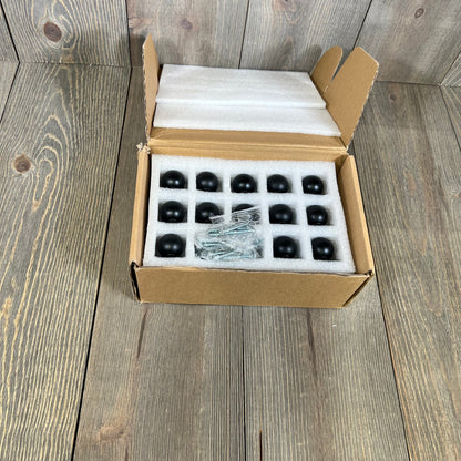 25 matte black kitchen cabinet knobs in open box with screws, ideal for drawers and doors.