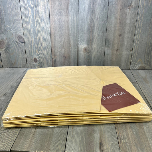 Stack of kraft-colored PACKHOME collapsible gift boxes with "Thank You" card, showcasing sturdy packaging design.