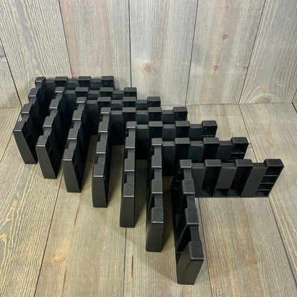 Black car trunk organizer blocks arranged on a wooden surface, ideal for SUVs and vans, enhancing cargo space management.