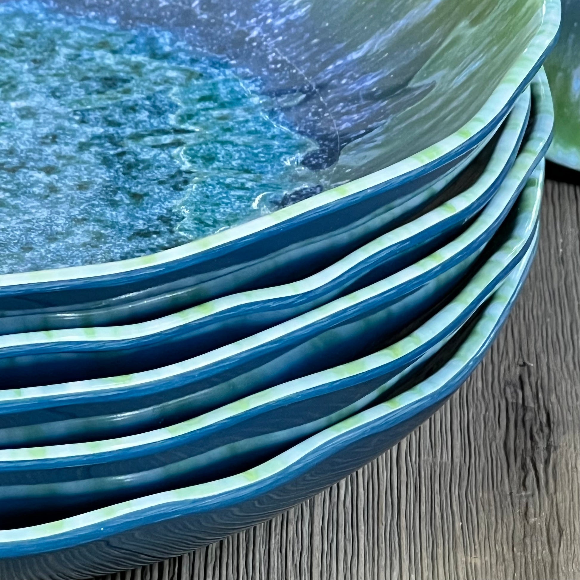 Stack of turquoise melamine pasta bowls with a textured finish, ideal for salads and soups, dishwasher safe.