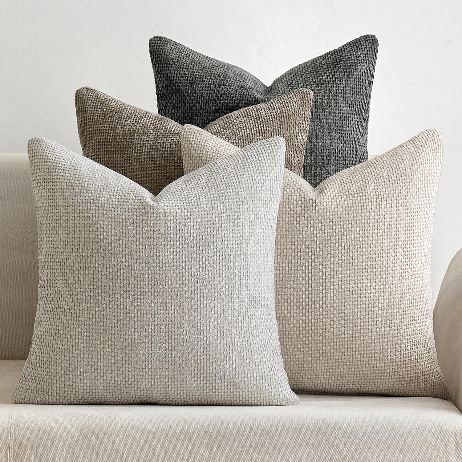 Neutral chenille pillow covers, set of 4, enhancing a modern sofa with a cozy farmhouse boho style.