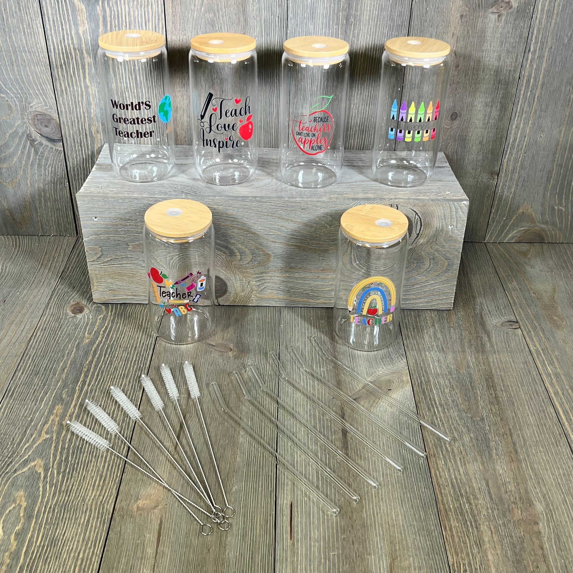 Teacher appreciation gift set with six 16 oz glass cups, lids, straws, and cleaning brushes, perfect for Teacher's Week.
