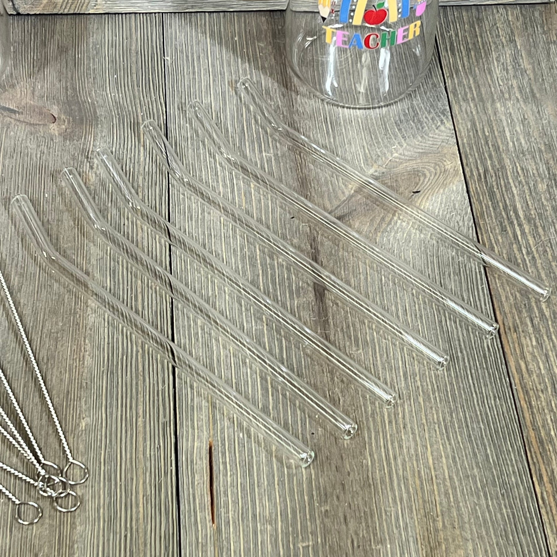 Glass straws and cup with colorful teacher design, part of Maxcheck 6 Sets Teacher Appreciation Gifts, 16 oz capacity.