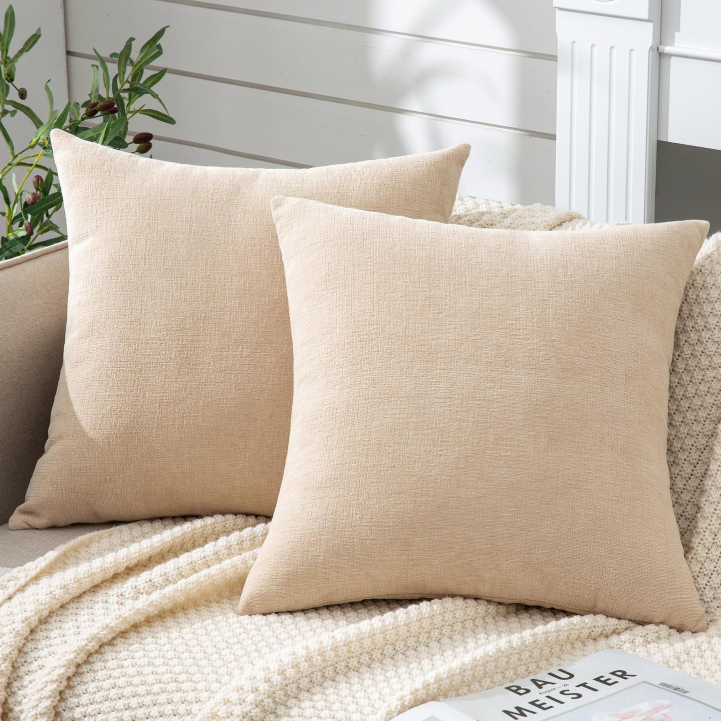 Beige chenille throw pillow covers on a cozy sofa, perfect for farmhouse decor. Set of 2, 20"x20", ideal for living room or bedroom.