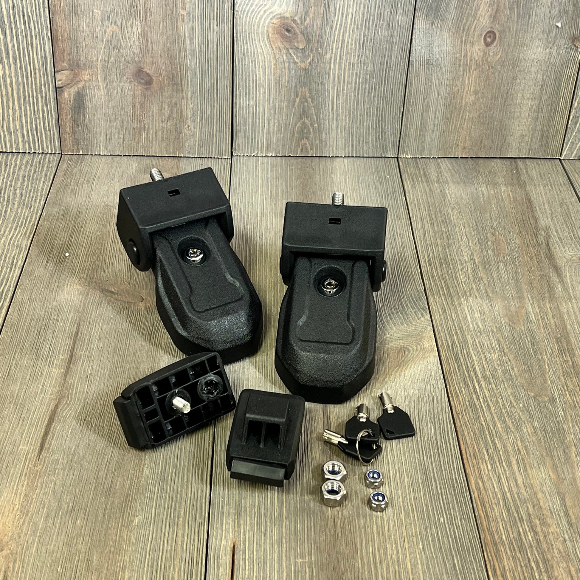 Black OEM hood latches with keys for Jeep Wrangler JL JLU Gladiator 2018-2024, enhancing security and style.