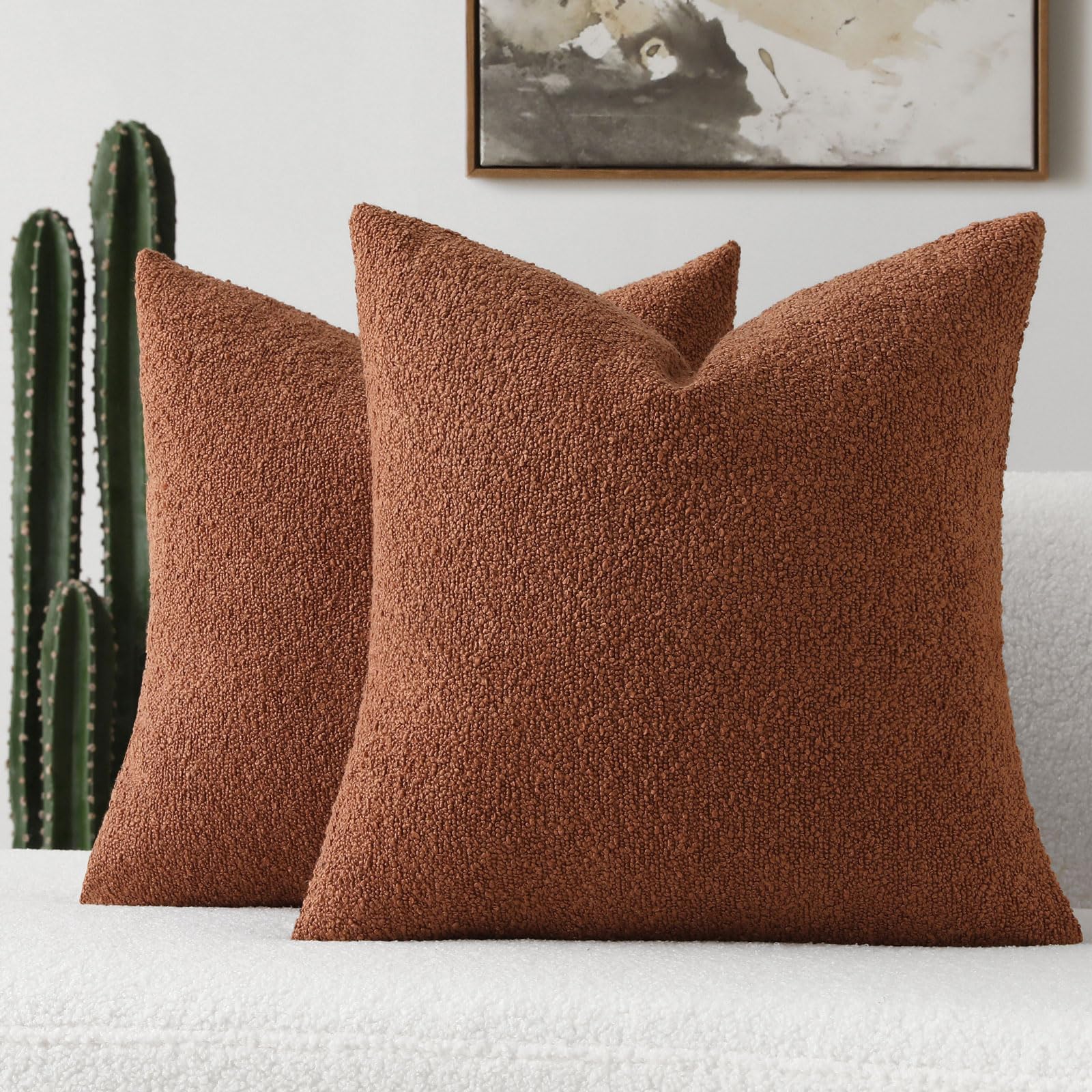 Rust-colored decorative throw pillow cover in soft boucle texture, perfect for modern home decor on couches and beds.