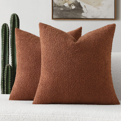 Rust-colored decorative throw pillow cover in soft boucle texture, perfect for modern home decor on couches and beds.