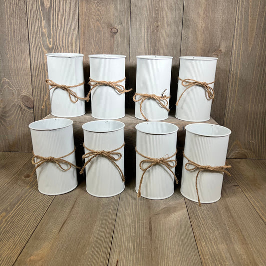 Rustic white farmhouse vases with twine bows, perfect for wedding centerpieces or home decor, set of 8 galvanized metal pieces.