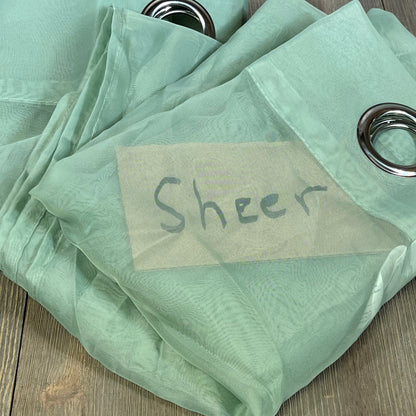 Sage green sheer window curtains with ring top design, perfect for farmhouse decor in living room or bedroom.