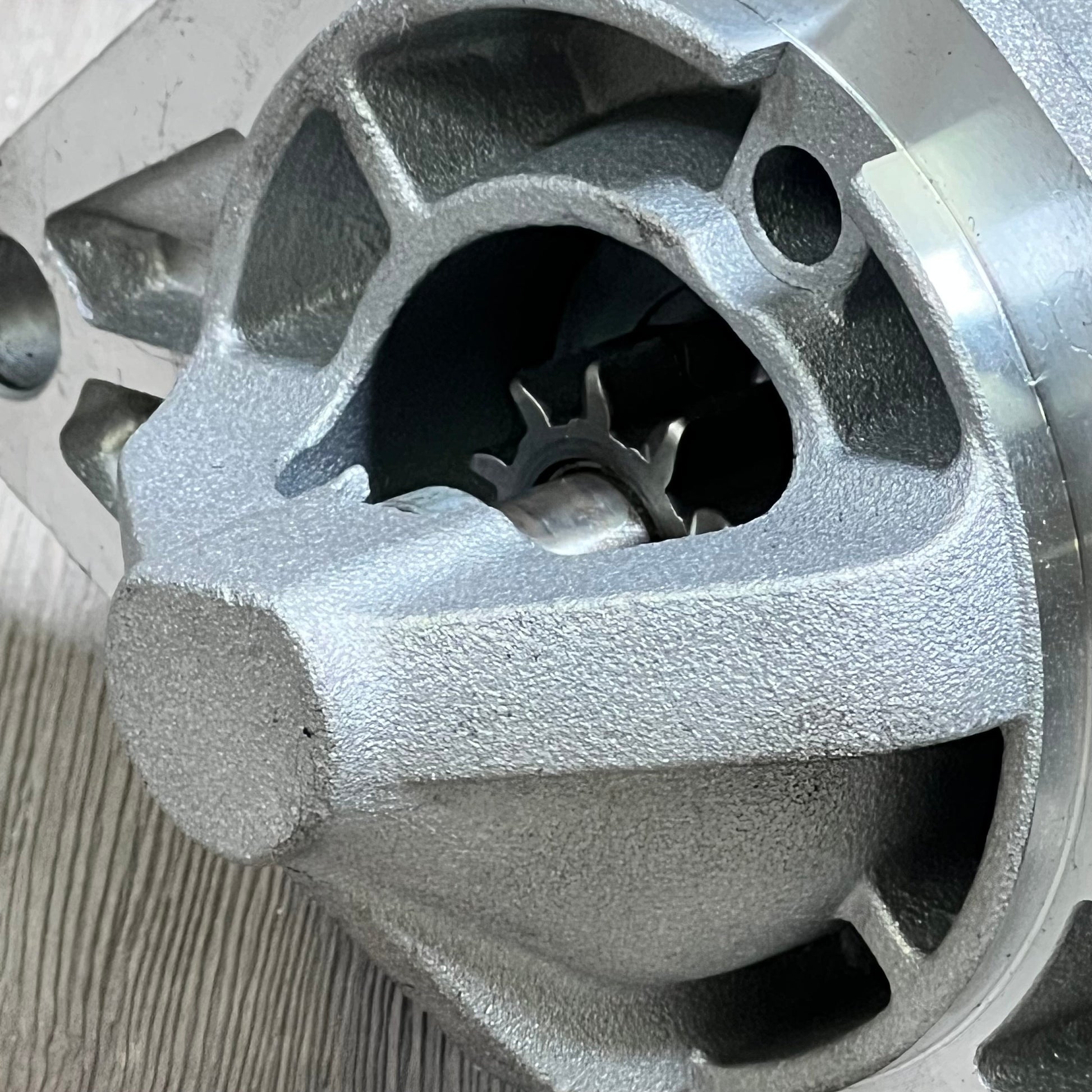 Close-up view of OCPTY starter compatible with Grand Cherokee 4.0L L6, highlighting the gear mechanism.