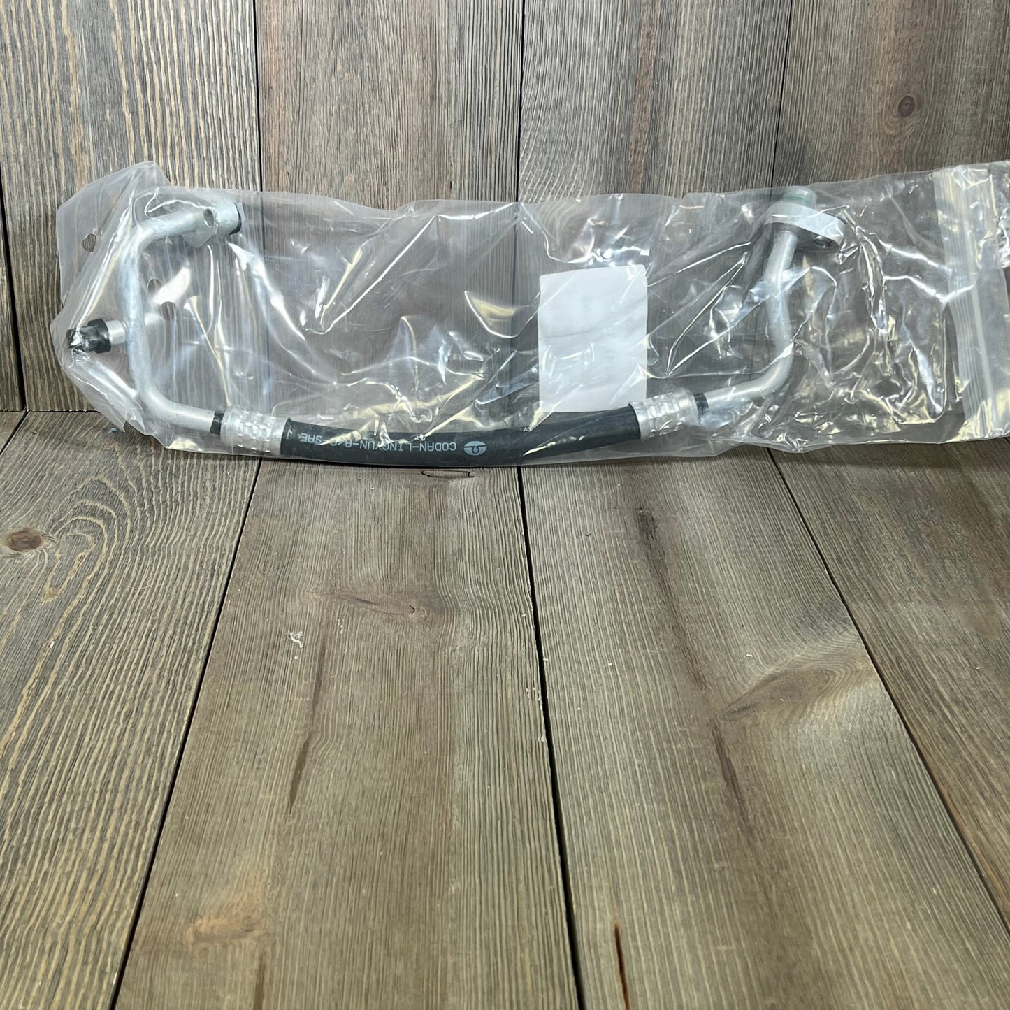 Premium A/C discharge line hose assembly for 2007-2011 Jeep Wrangler V6 3.8L, compressor to condenser connection.