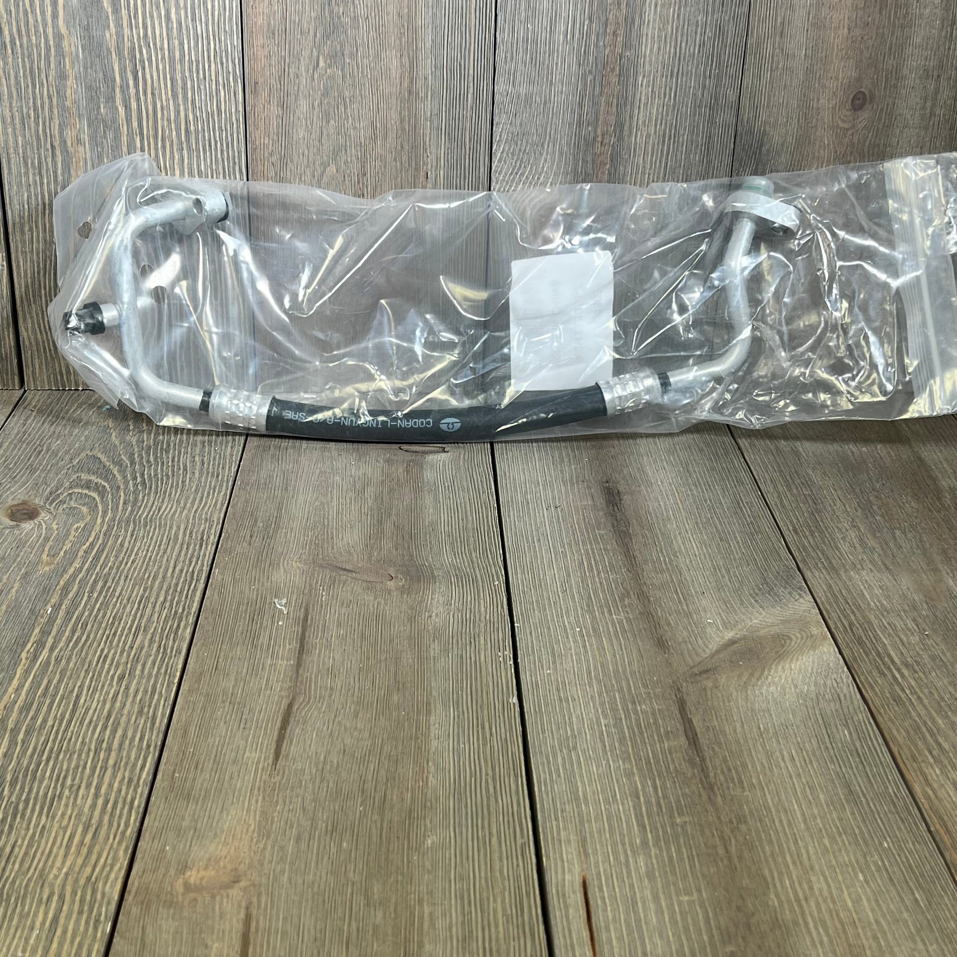 Premium A/C discharge line hose assembly for 2007-2011 Jeep Wrangler V6 3.8L, compressor to condenser connection.