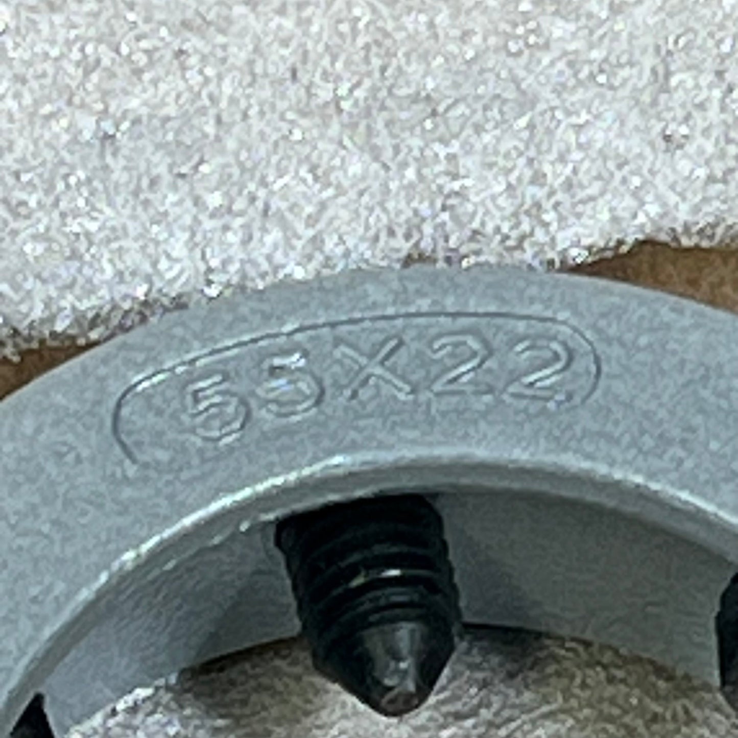 Close-up of uxcell 55mm die stock handle, showing detailed engraving and durable metal construction for M24-M27 metric use.