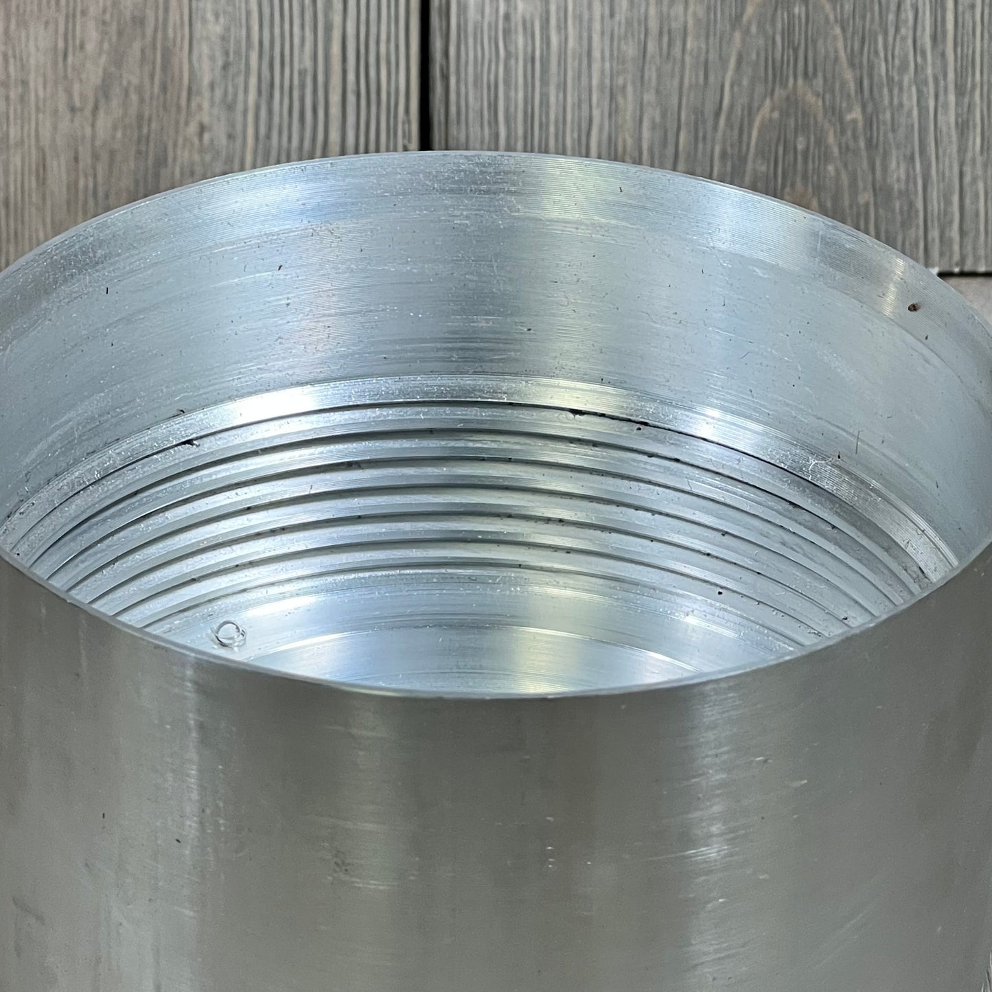 Close-up of Mallofusa fuel filter housing for 6.7L Powerstroke Diesel, showcasing threaded interior details.