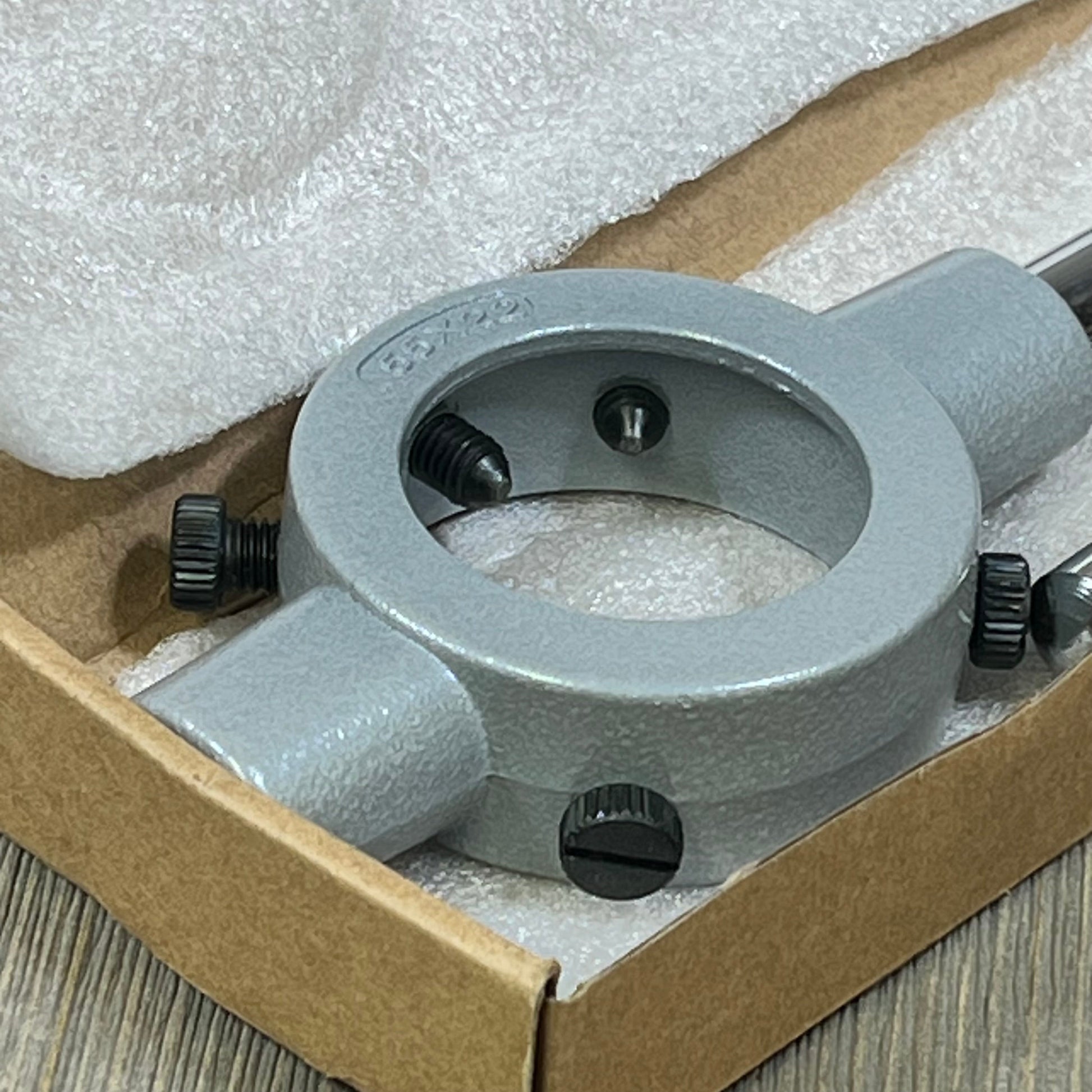 Gray die stock handle wrench for M24-M27, 55mm, in a box with protective padding, highlighting durable design.
