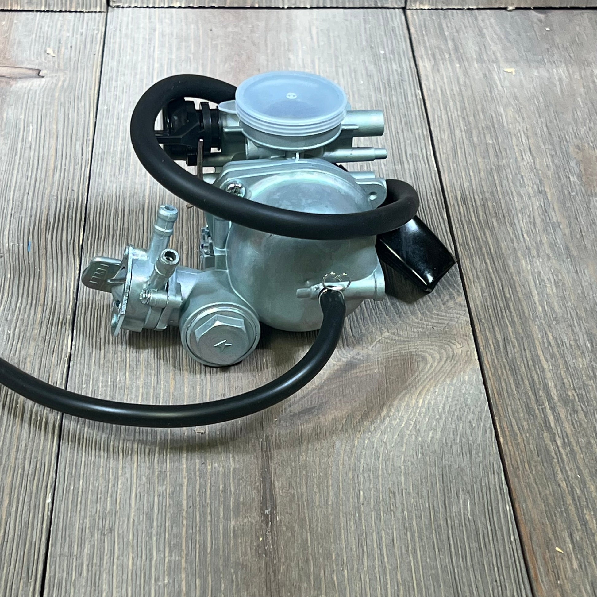 Replacement carburetor for Honda TRX 90 EX, featuring durable metal build and precise fit for 1993-2006 models.