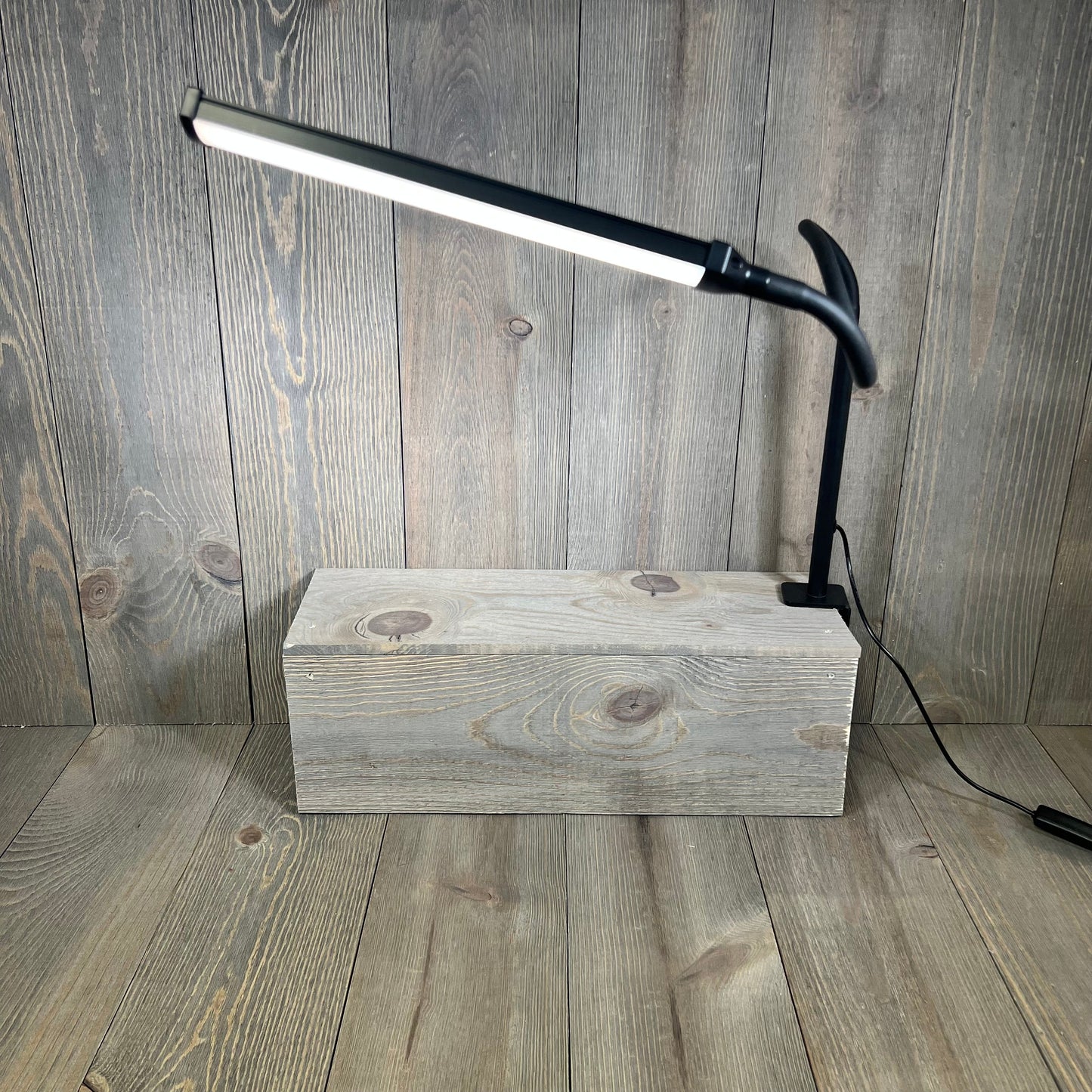 Black LED desk lamp with flexible gooseneck and clamp, perfect for home office lighting and eye care.