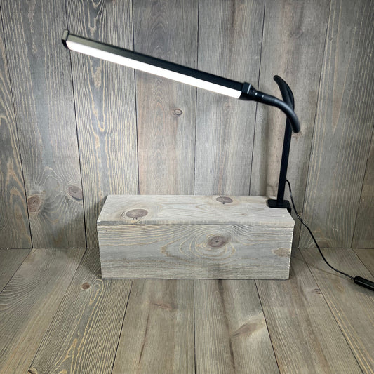 Black LED desk lamp with flexible gooseneck and clamp, perfect for home office lighting and eye care.