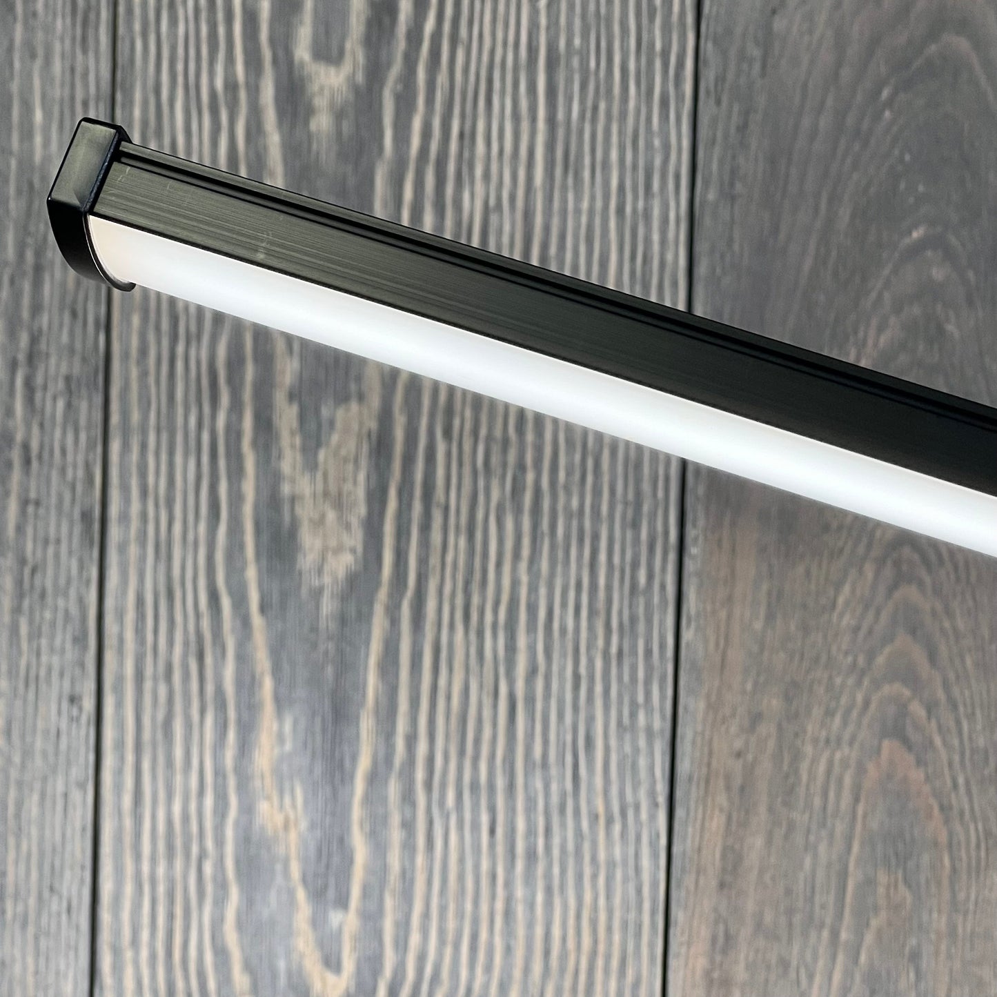 Sleek black LED desk lamp with a modern design, perfect for home office, featuring eye-caring light and a flexible gooseneck.