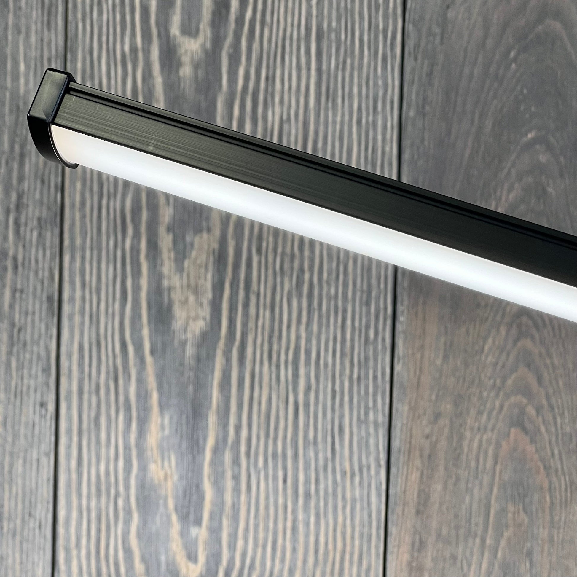 Sleek black LED desk lamp with a modern design, perfect for home office, featuring eye-caring light and a flexible gooseneck.