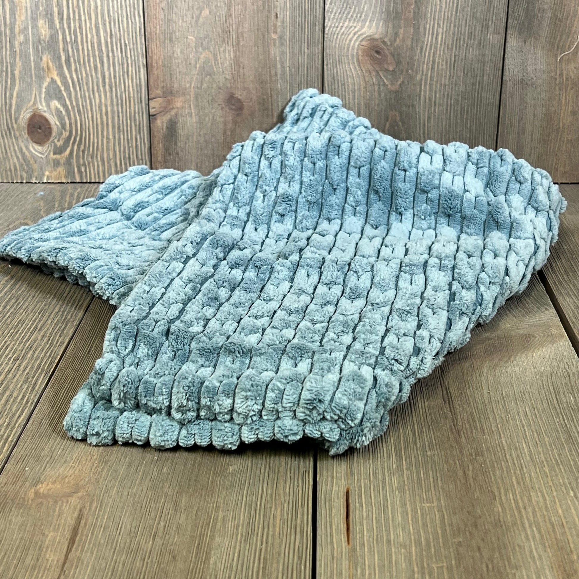 Soft blue-grey corduroy throw pillow cover with boho stripes, perfect for farmhouse decor on couch or bed.
