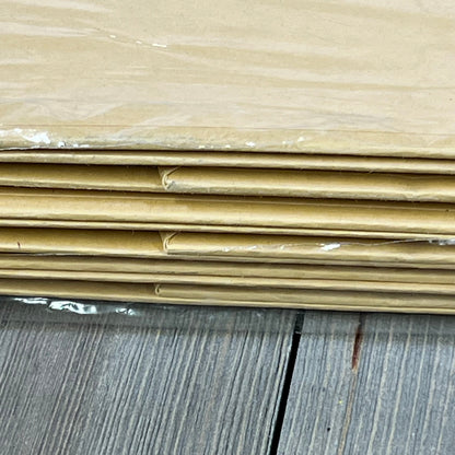 Stack of flat PACKHOME large kraft gift boxes, showcasing sturdy collapsible design with magnetic closure, on wood surface.