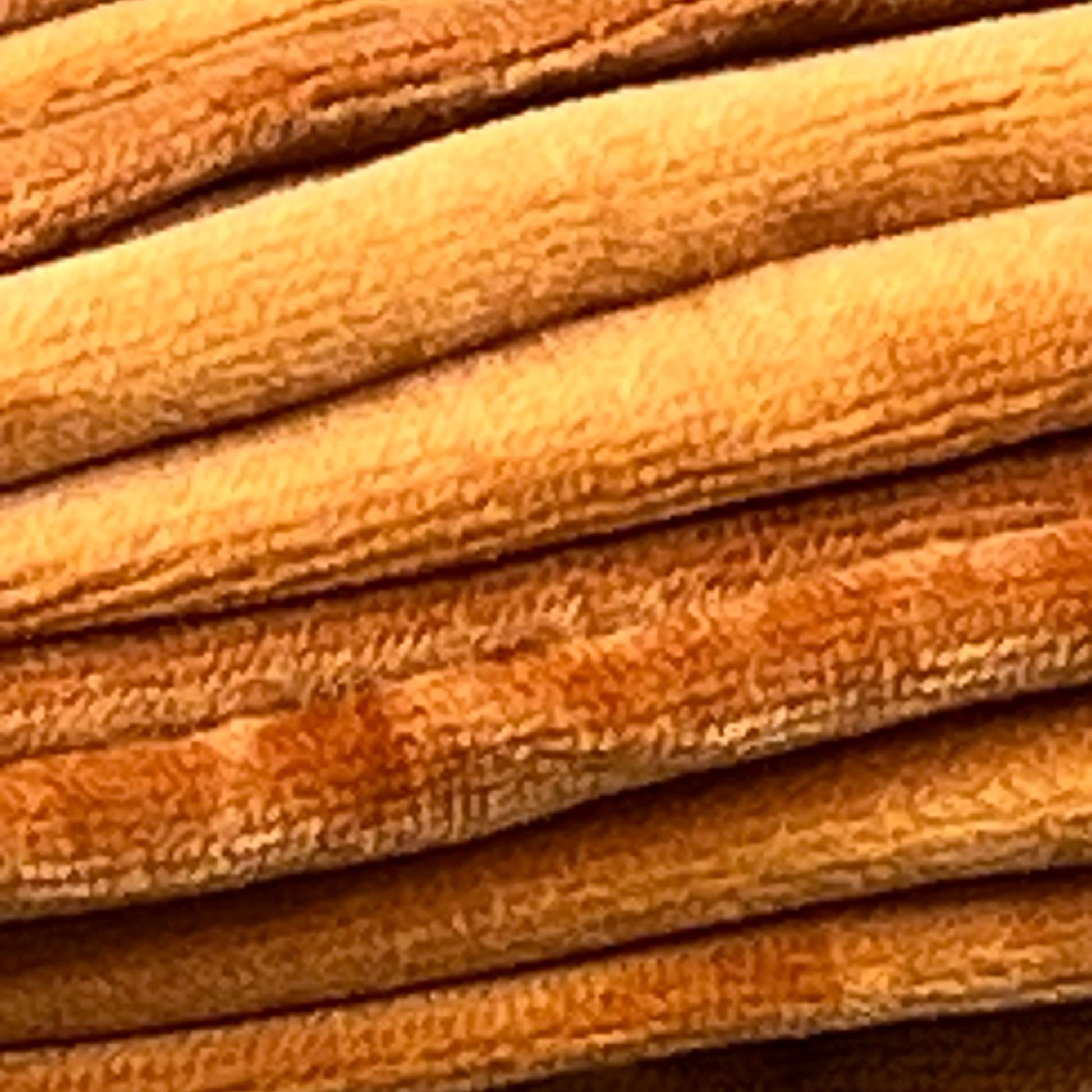 Rust velvet fabric texture of JUSPURBET luxury throw pillow covers, perfect for living room or bedroom decor.