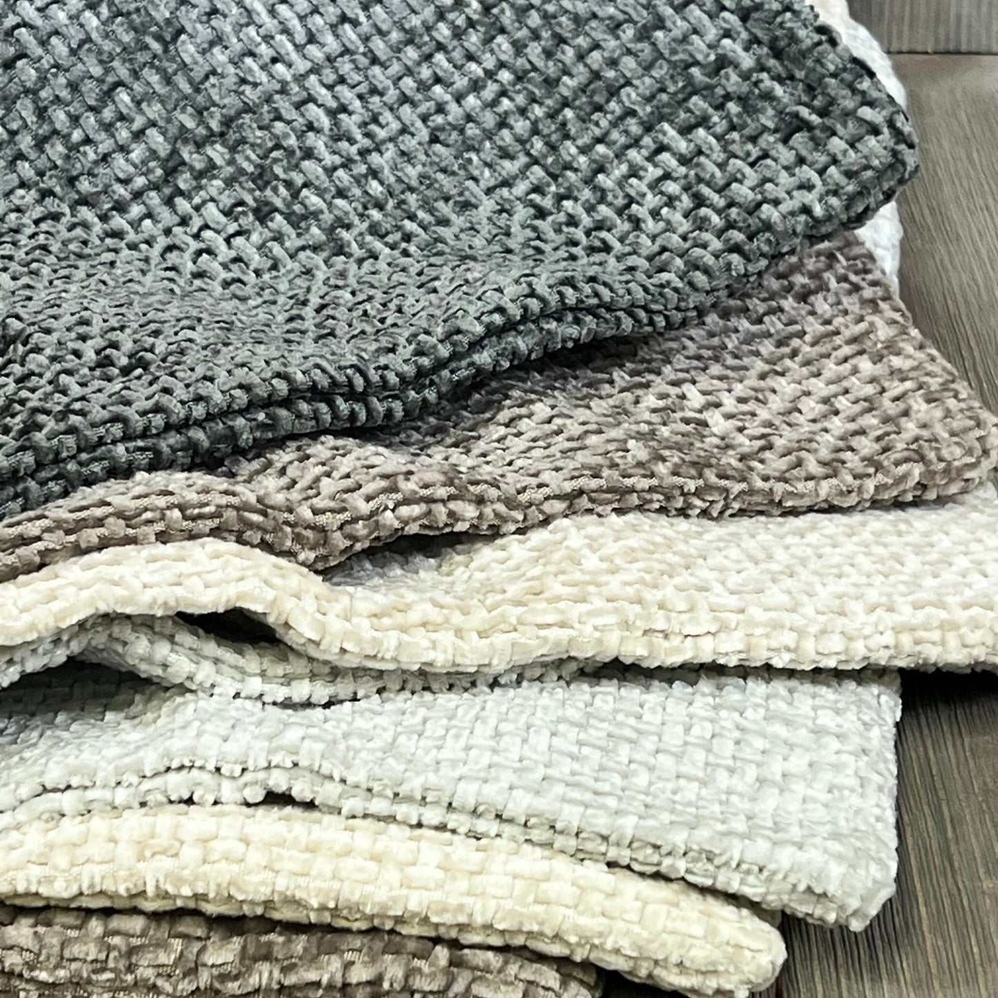Neutral chenille pillow covers stacked, showcasing soft texture and boho farmhouse style for modern home decor.