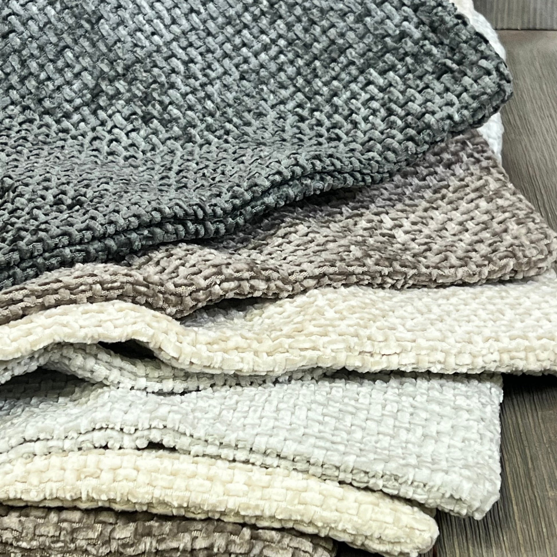 Neutral chenille pillow covers stacked, showcasing soft texture and boho farmhouse style for modern home decor.