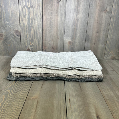 Neutral chenille pillow covers in a stack, showcasing soft textured fabric perfect for farmhouse and boho decor.