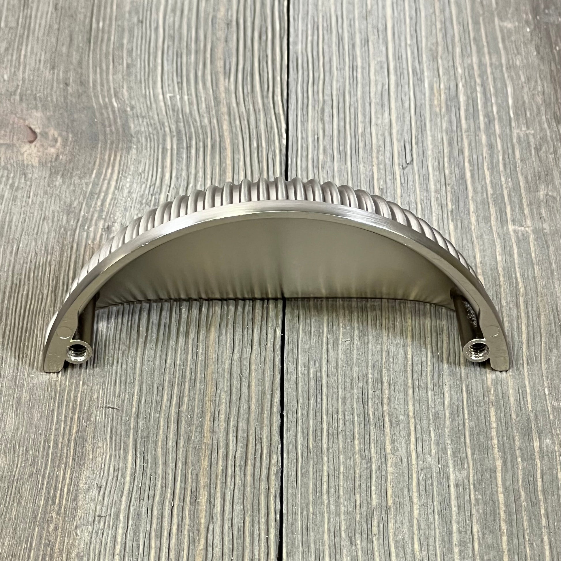 Brushed satin nickel cabinet handle with ribbed design, perfect for kitchen drawers and cupboards. 3-inch size.