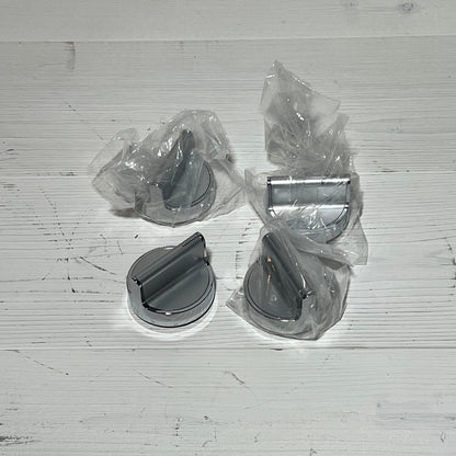 Stainless steel gas stove knobs replacement set for Whirlpool range, shown in packaging on a wooden surface.