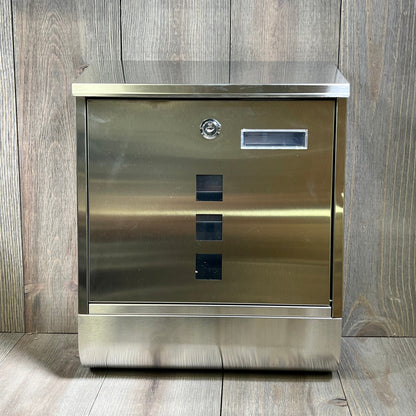 Stainless steel wall-mounted mailbox with key lock, featuring a newspaper compartment and sleek silver finish.