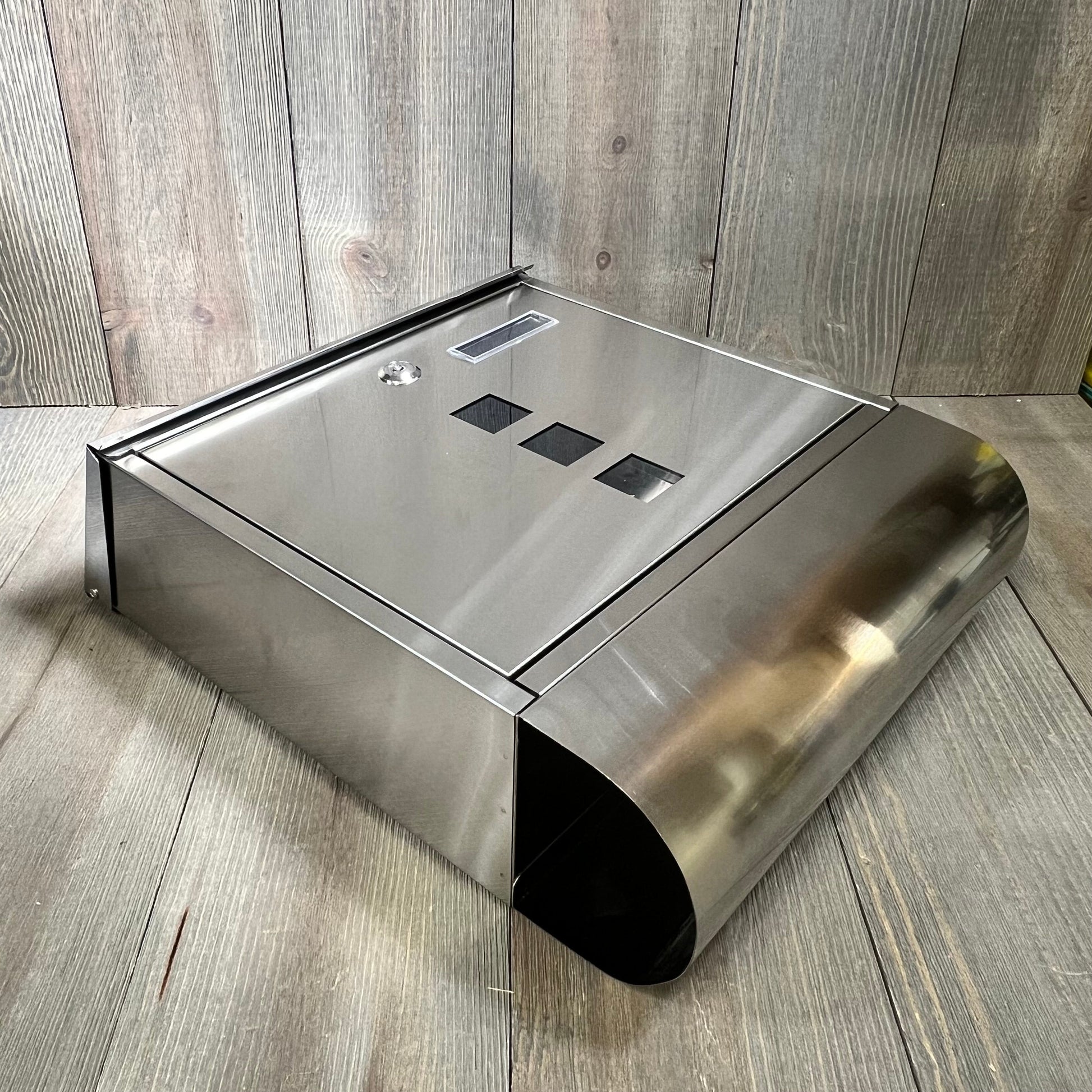 Stainless steel wall-mounted mailbox with key lock and newspaper compartment, featuring a sleek silver design, 15.4"x12"x4.8".